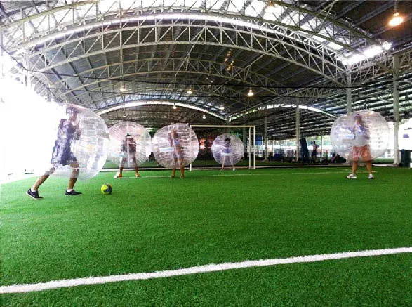 Comparison of land and water zorbing experiences in Singapore, showcasing the unique thrills of each